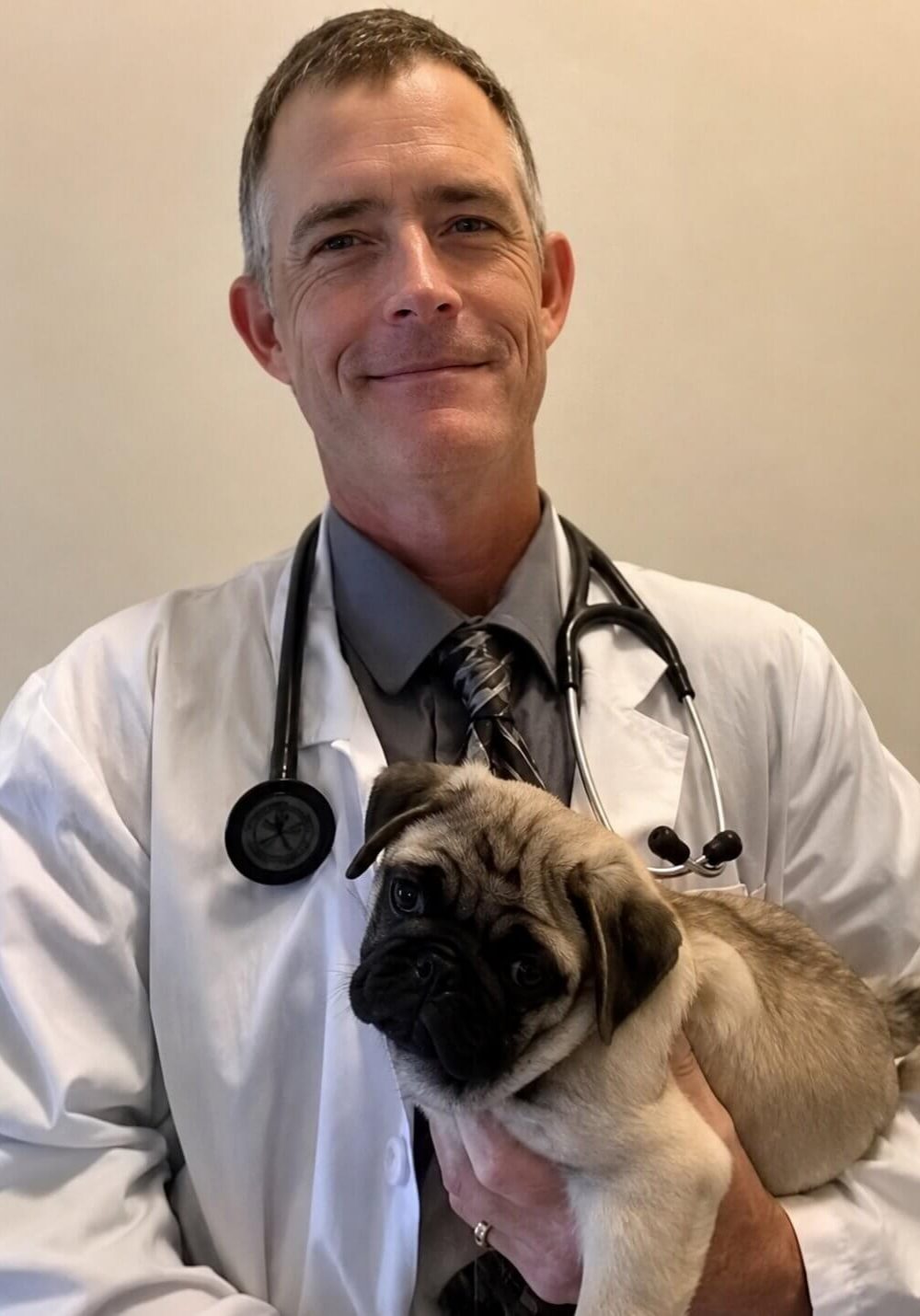 happy Jacksonville FL pet owner reviewing SJB Animal Care Center